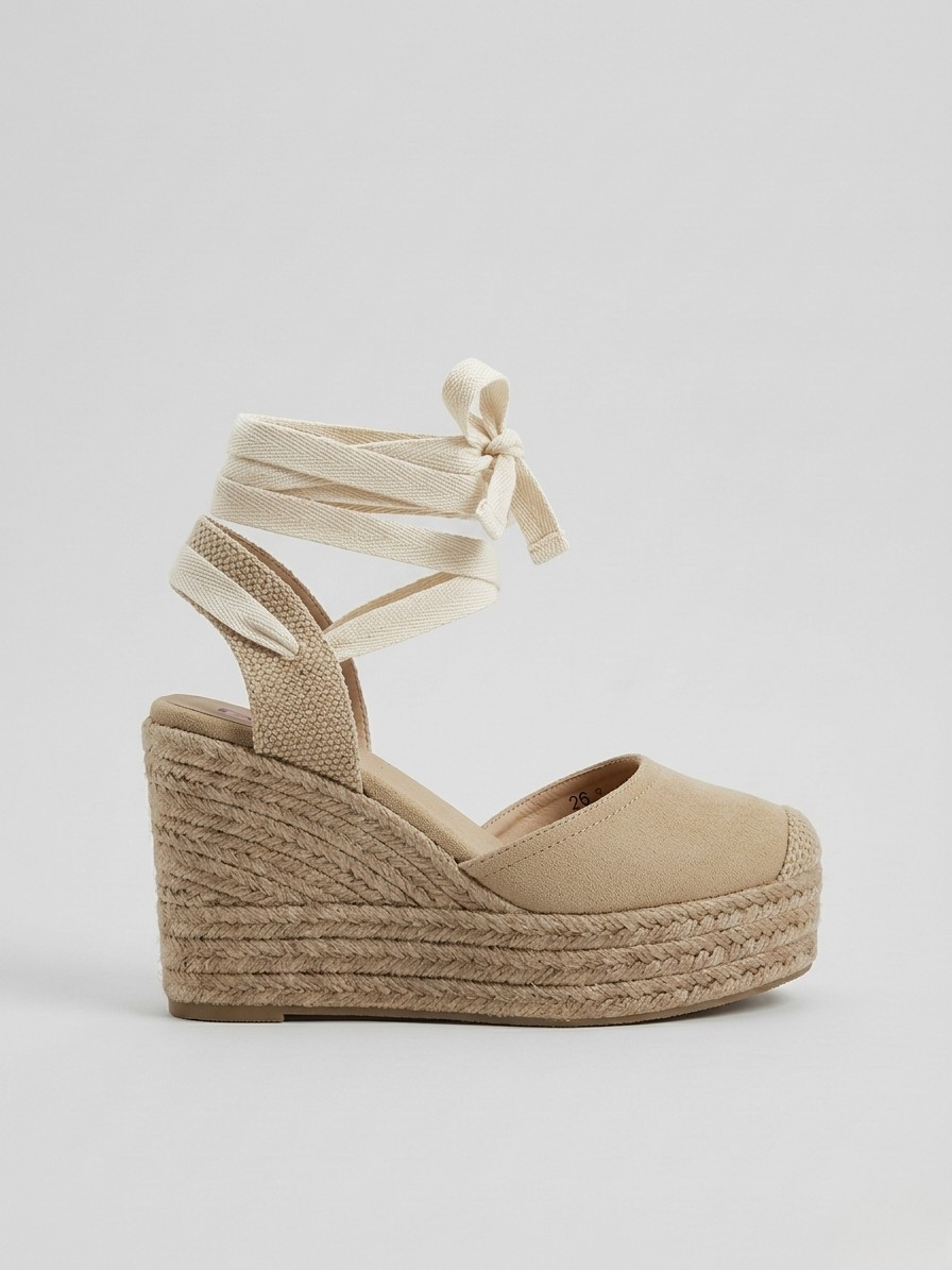 ALPARGATA CUÑA ALTA BEIGE